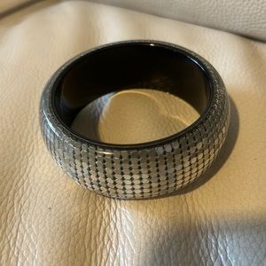 Lucite bangle bracelet with metal mesh inside